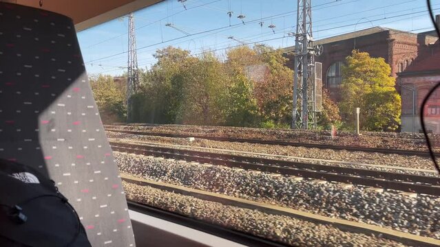 Window view from a moving train over the buildings in Brussels, Belgium
