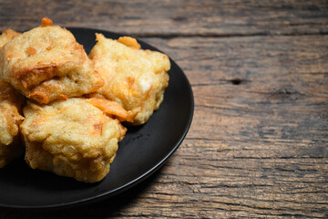 Gorengan or Fried tofu on a white plate. Fried food is one of the favorite snacks in Indonesia