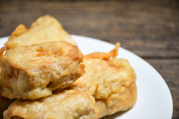 Gorengan or Fried tofu on a white plate. Fried food is one of the favorite snacks in Indonesia