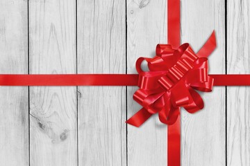 Decorative beautiful red ribbon bow on desk