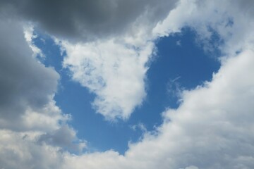 Heart shape in blue sky, natural background 