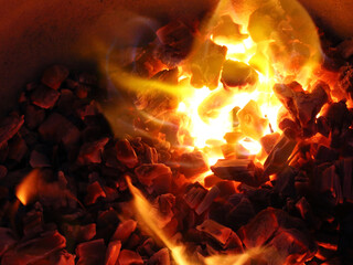 hot coals in the oven in a handmade barbecue close-up
