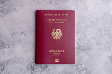 German passport on marble floor. Isolated german passport. Travel to Germany. Travel documents and...