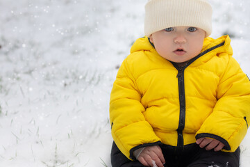 Portrait of a little boy in a yellow suit