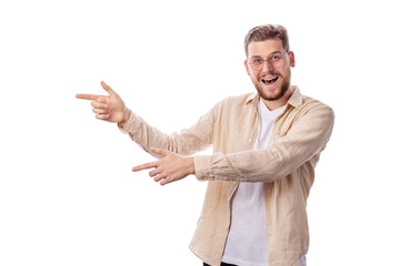 Happy smiling young caucasian male isolated on white background making pointing gestures, advertisement