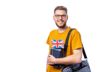 Handsome young caucasian guy holding british flag smiling to camera, isolated on white