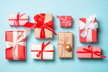 Christmas presents on blue background top view.