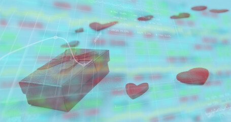 Image of gift box and heart shapes over moving graphs and trading board