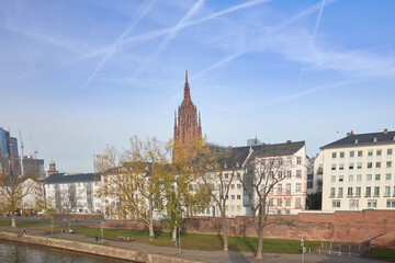 View of the tower of the Imperial Cathedral, from the river Main, in Frankfurt, Germany.