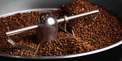 Banner industry photo of food, Roasting process coffee beans on professional mixing roaster machines