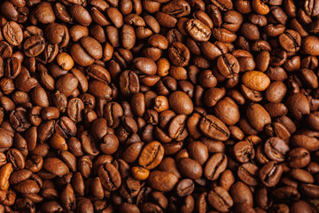 Brown background arabica coffee beans for espresso