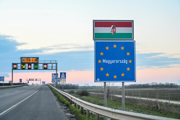 Sign at the entrance to Hungary. The border between the Romania and Hungary. Highway. Inscription:...