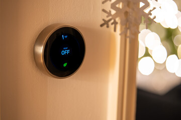 Smart Thermostat with Heat Off Status with Christmas decorations and fairy lights in background