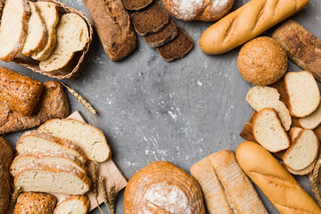 Homemade natural breads. Different kinds of fresh bread as background, top view with copy space