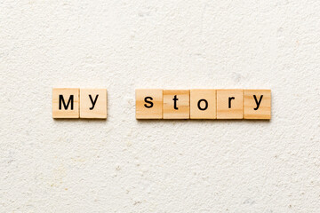 My story word written on wood block. My story text on cement table for your desing, concept