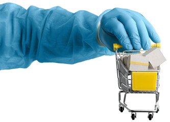 A hand medical with a basket walks in a supermarket