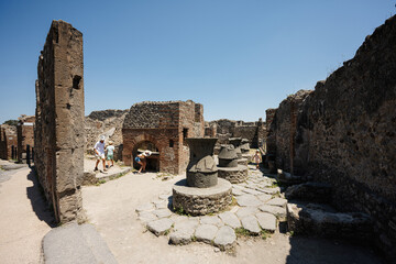 Children tourist walking at Pompeii ancient city, Italy.