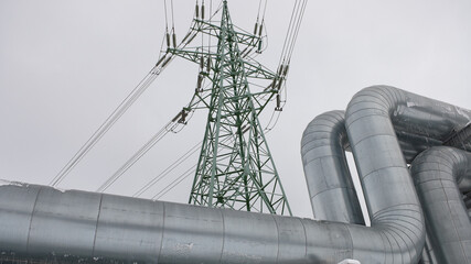 pipeline and power line on a gray sky background