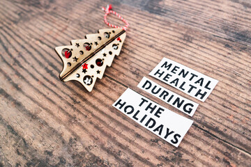 mental health during the holidays text next to festive Christmas decoration, managing overwhelm and...