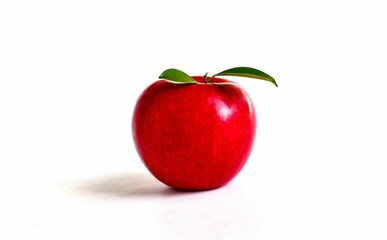 Red apple with green leaves isolated on white background.