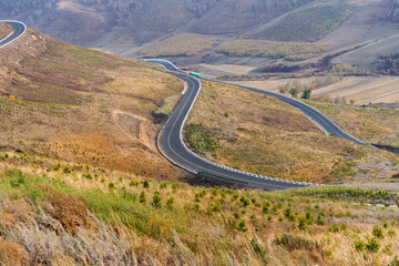 Winding road in mountain valley