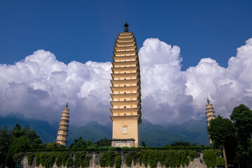 Front wide angle view of the Three Pagodas of Chongsheng Temple with dramatic overcast weather in Dali Yunnan China