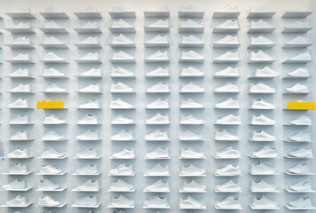 Store wall with white sneakers