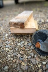 tyre blocks stuck behind a wheel, for a trailer in a park for camping