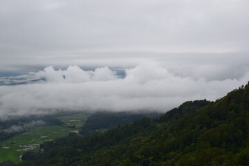 Fototapeta premium View of the Land above the Clouds (village above the Clouds) Lolai Hills Village and traditional village covered by clouds in the morning before sunrise