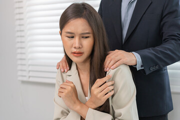 Unhappy, disgusted asian young employee, business woman defending hand of colleague, push out protect when boss touching her body, embrace shoulder. Sexual harassment inappropriate at office,workplace