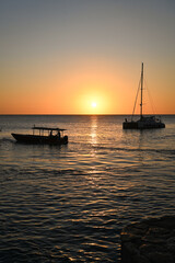 Fototapeta na wymiar Sunset and boat in Jamaica