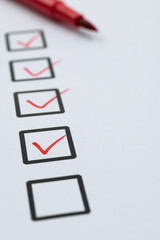 Red pen marking on checklist sheet
