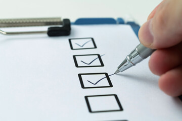Black pen marking on checklist sheet