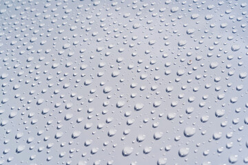 small drops of water on a white background texture, macro.