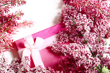 Spring concept. Lilac branches and gift box