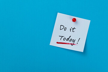 Do it today note on blue background