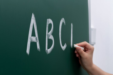 Alphabet abc writing on blackboard
