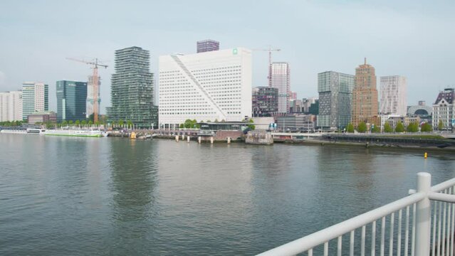 Rotterdam Nieuwe Maas riverside city skyline from Willemsbrug bridge.