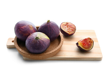 Wooden board with plate of fresh ripe figs on white background, closeup