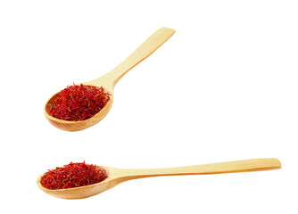 wooden spoon with dried saffron spice isolated on white background.
