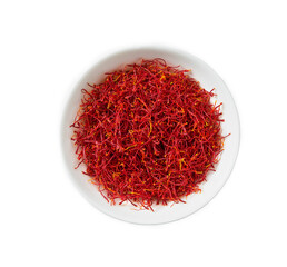 Dried saffron spices in a ceramic bowl isolated on white background top view.