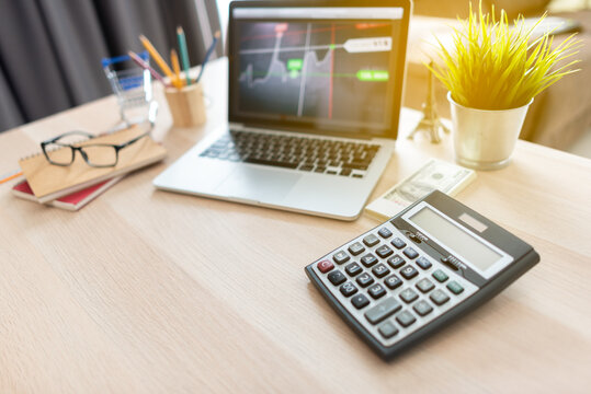 Calculator and work equipment of businessman on table