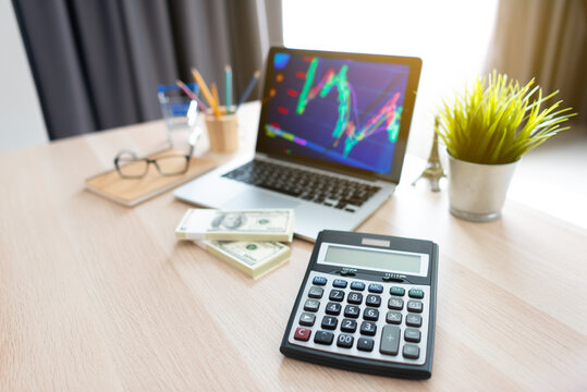 Calculator and work equipment of businessman on table