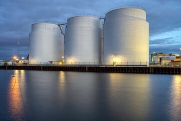 Storage tanks for crude oil at dusk seen in Berlin
