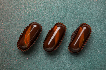 Chocolate candies on grunge background