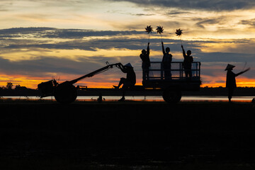 Asian Men and Women Gathering farmers produce rice export in rural communities.  in the Morning, Light as a Silhouette