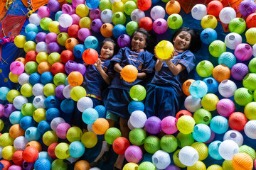 Asian Thai children running after school.