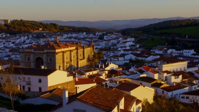relaxing countryside rural spanish andalucia sierra jamones old white villages of the Sierra de Aracena, Huelva Jabugo brown colors of the roofs and white of the houses during an unique sunset
