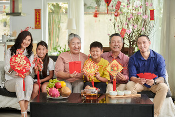 Joyful family showing Chinese New Year celebration attributes with prosperity and luck inscription