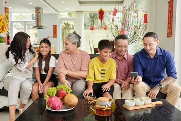 Happy family gathered at home to celebrate Lunar New Year